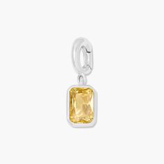 Add a touch of personal charm with the Mackenzie Hinge Birthstone Charm. This playful addition features a convenient hinge closure and customizable birthstone, making it a fun and unique way to express yourself. Available in 14k gold plated sterling silver or rhodium plated sterling silver 1/8"x1/4" charm 5mm Cubic Zirconia NOTE - If you are looking to add or remove the birthstone charm from an existing chain, the hinge will need to be opened. NOTE - Birthstone color may slightly vary per the co Classic Huggie Birthstone Jewelry, White Gold Birthstone Dangle Jewelry, Yellow Birthstone Jewelry In Cubic Zirconia, Yellow Cubic Zirconia Birthstone Jewelry, Minimalist Jewelry With Rectangular Birthstone, Minimalist Rectangular Birthstone Jewelry, Everyday Nickel-free Cubic Zirconia Jewelry, Modern White Gold Jewelry With Birthstone, White Gold Sterling Silver Jewelry With Rectangular Stone