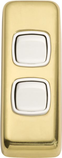 an image of two white buttons on a gold case