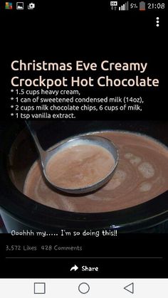 an image of a bowl of hot chocolate with a spoon in it and the words christmas eve creamy crockpot hot chocolate