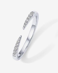 Elevate your style with our cubic zirconia eternity band, a symbol of eternal love. This modern, dainty piece is perfect for the fashionable woman, featuring a unique open design and an array of sparkling stones. Perfect for every finger, from pinky to thumb. Materials 18K yellow gold or white gold plated. AAAAA Premium Cubic Zirconia. Hypoallergenic; nickel, lead, and cadmium free. Measurements Ring Size: #5, #6, #7, #8, #9. Band Width: 2mm; Opening: 3.6mm. Stone sizes: 1mm; 1.3mm; and 1.5mm CZ Fine Jewelry Crystal Ring With Open Band, Minimalist Diamond White Open Band Ring, Modern Adjustable Diamond Ring With Open Band, Modern Open Ring In Diamond White, Adjustable Modern Open Band Diamond Ring, Modern Adjustable Open Band Diamond Ring, Modern Diamond White Open Ring, Stackable Cubic Zirconia Half Eternity Rings, Silver Half Eternity Open Ring Jewelry