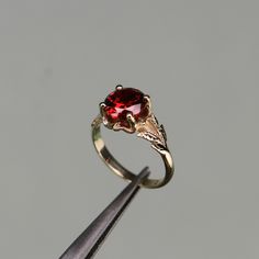 Garnet Gold Plated 925 Silver Ring, Red Stone Ring, Unique Engagement Rings, Propose Ring For Women, Dainty Branch And Leaves -->Ring details: - Theme: Daily, Minimalist, Romantic Wedding & Engagement - Comfortable band - Center Stone : Garnet - Garnet Carat: 8mm --->Materials:   - 925 Silver Gold Plated --->The ring size on the model is 6 US. --->Items are shown larger in pictures to show detail - please note the dimensions. This item is in my shop are handcrafted made to order. --->Accessories Classic Red Promise Ring, Red 14k Gold Birthstone Ring For Promise, Red Birthstone Promise Ring Fine Jewelry, Red Solitaire Ring For Promise, Red Solitaire Promise Ring, Red Birthstone Promise Ring With Round Band, Fine Jewelry Red Round Band, Red Rings With Accent Stones And Round Band, Red Garnet Round Band Jewelry