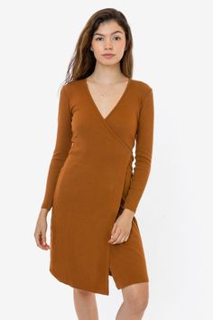 This classic wrap dress is made of a 2x1 ribbed heavy cotton spandex, with a feminine drape and stretch. This dress features long sleeves, an integrated front slit and a-line mid-length skirt and comes with a long tie that can be worn to the front or back. Perfect for date nights but also casual enough for everyday wear. Try pairing with tights and heels or a matching wrap coat. We recommend sizing down in this style if you prefer a more fitted look. This item is a garment dye product. Garment d Wrap Dress Styles, Tights And Heels, Ginger Dress, Cherry Dress, Wrap Coat, Mid Length Skirts, Black Wrap Dress, Lovely Dresses, Cotton Spandex