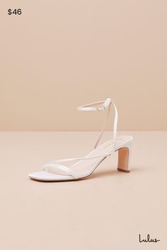 Keep things chic and simple by adding the Lulus Kierha White Satin Strappy Low Heel Sandals to any of your effortlessly elegant 'fits! Sleek woven satin shapes these darling heels that feature a square footbed and a trio of slender straps that cross the vamp. A matching strap wraps the front of the ankle and secures with a gold buckle, all atop a trendy blade heel. 2. 75" wrapped blade heel. Cushioned insole. Felted rubber sole has nonskid markings. Man made materials. Imported. Lulus | Kierha W Spring Wedding Shoes With Wrapped Heel And Ankle Strap, Low Heel Satin Wedding Shoes For Summer, Elegant Kitten Heels With Heel Loop For Spring, Low Heel Satin Heels, Chic Synthetic Wedding Shoes With Heel Strap, Satin Heels With Low Heel, Chic Wedding Shoes With Sculpted Heel For Spring, Fitted Satin Heels With Low Heel, Chic Spring Wedding Shoes With Sculpted Heel