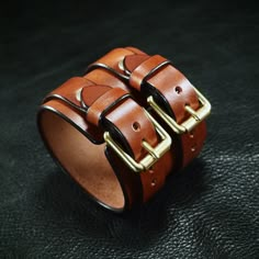 "This Pecan brown leather cuff bracelet is made from 8 oz rich brown bridle leather.  It is hand worked, edged and polished to perfection. Brass roller buckles close it up. ( also available in nickel) You will love this cuff! I need a wrist size! Instructions in the pics above! - 2.5\" wide - Beautiful bridle leather - Fine workmanship Thx! Freddie ✻ Please leave all size information in the notes to seller at the end of checkout! You can also message it to me. In any event, I will confirm the order and size once received.🙂" Vintage Brown Cuff Bracelet With Wrist Strap, Vintage Leather Wristband With Leather Strap, Rugged Leather Bracelets, Classic Leather Cuff Bracelet, Brown Leather Bracelets With Brass Hardware, Vintage Brown Leather Strap Wristband, Distressed Brown Leather Cuff Bracelet, Classic Handmade Leather Cuff Bracelet, Brown Leather Cuff Bracelet With Strap