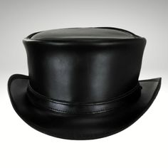 Mens Black Leather Top Hat - Made with genuine leather.  We presents the sleek and streamlined Black Leather Top Hat for those who prefer a simpler design.  Cowhide suede, a narrow self-leather Black Leather Top Hat strap adorns the short pointed crown.  This leather item is handmade with cowhide leather and is from expert craftsmen.  This is a stylish and durable item. Our products are of the highest quality. We guarantee satisfaction. Leather Hat With Flat Brim For Formal Occasions, Formal Leather Hat With Flat Brim, Formal Flat Brim Leather Hat, Classic Leather Top Hat With Short Brim, Black Leather Hat With High Crown, Classic Short Brim Leather Top Hat, Fitted Leather Hat With Short Brim, Fitted Leather Top Hat With Short Brim, Fitted Leather Top Hat With Flat Brim