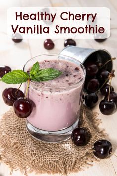 a smoothie in a glass with cherries around it and the words healthy cherry vanilla smoothie