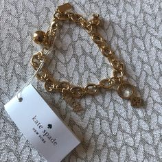 Adorable Kate Spade Bridal Charm Bracelet!! Brand New. Dust Bag And Box Can Be Sent By Request As Well. Elegant Gold-tone Charm Bracelet With Logo, Elegant Charm Bracelet With Logo Charm As Gift, Elegant Kate Spade Metal Bracelets, Elegant Metal Bracelets By Kate Spade, Kate Spade Gold Bracelet Jewelry, Kate Spade Gold Bracelets, Kate Spade Gold Bracelet, Kate Spade Bridal, Kate Spade Bracelet