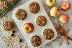 muffins with apples and cinnamon on a white tray next to oatmeal