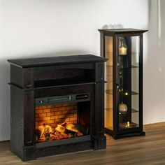 an entertainment center with a fireplace in the corner and a glass case next to it