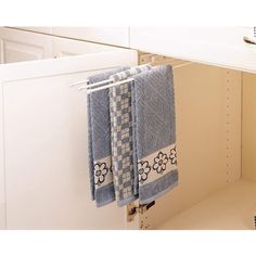 two blue towels hanging on a towel rack