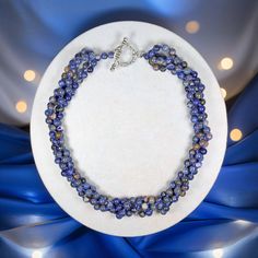 "Four Strands of hand-beaded and knotted genuine Sodalite round beads make this beautiful statement necklace. Necklace Length: 19\" L. Major Beads/material: 7mm round-shaped Sodalite and blue thread. Color: Blue Findings: silver-tone toggle clasp. Workmanship: each bead is hand-beaded and knotted  https://www.etsy.com/shop/MYGEMSROCK" Handmade Sodalite Round Bead Necklaces, Handmade Sodalite Round Beads Necklace, Blue Lapis Lazuli Crystal Necklaces With Round Beads, Lapis Lazuli Gemstone Beads Crystal Necklace, Lapis Lazuli Crystal Necklace With Gemstone Beads, Sodalite Gemstone Beads Necklaces, Blue Lapis Lazuli Round Beads Crystal Necklace, Blue Sodalite Round Beaded Jewelry, Lapis Lazuli Faceted Bead Necklaces