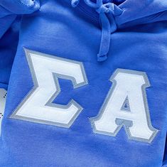 This trendy, unique, handcrafted Glitter Comfort Colors Greek Letter Hoodie Sweatshirt is sure to stand out on any campus! Grab one for you, your big/little, or a group of sisters (bulk discount information can be found below). If you need some greek letter shirt inspiration, please visit the inspiration page! Picture Details Pictures: ⭑ #1-3: Flo Blue sweatshirt, White Glitter top fabric, Grey background fabric Care Instructions ⭑ Wash inside out on cold & air dry for best results ⭑ This item i Greek Letter Shirts, Letter Shirt, Sorority Sweatshirts, Sorority Letters, Letter Hoodie, Letter Sweatshirt, Fabric Letters, Background Fabric, Greek Letters