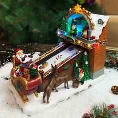 a toy sleigh with santa claus and other toys