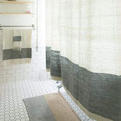 a bathroom with two towels hanging on the wall