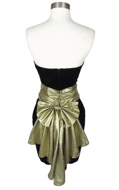 Glamorous Fitted Evening Skirt, Fitted Evening Skirt, Fitted Retro Mini Dress For Parties, Chic Gold Strapless Evening Dress, Chic Gold Strapless Dress For Evening, Glamorous Holiday Evening Skirt, Retro Fitted Skirt For Party, Mini Skirt For Party Season Evening, Party Season Mini Skirt For Evening