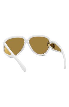 Looping golden logos adorn the tapered temples of sleek Italian-made pilot sunglasses shaped in a mask-inspired silhouette. 65mm lens width; 14mm bridge width; 145mm temple length 100% UV protection Injected plastic Made in Italy Brown Mirror, Golden Logo, Pilot Sunglasses, Uv Protection, Nordstrom, Mask, Sunglasses