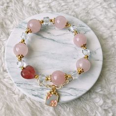 📝Material and Size Rose Quartz Beads: around 12mm Red Heart Bead is Strawberry Quartz 14k Gold Filled decoration beads Clear bead is Xilion Bicone (Also name as Swarovski crystal) Bracelet length: around 14cm 💜You will receive the exactly same bracelet as shown in the photo. 💜This handmade Jewelry listing come with an anti-oxidized jewelry box. 💜Please ensure you have no metal allergy before purchasing 💜Keep in mind these are natural stones and they may have small cracks and imperfections. Elegant Beaded Charm Bracelet For Valentine's Day, Valentine's Day Elegant Beaded Charm Bracelet, Elegant Beaded Bracelets With Heart Beads As Gift, Elegant Charm Bracelet With Heart And Round Beads, Elegant Heart Beads Bracelet, Heart Bracelet With Round Beads As Gift, Heart-shaped 8mm Bead Jewelry Gift, Elegant Beaded Bracelet With Heart Charm For Valentine's Day, Rose Gold Jewelry With 8mm Beads For Gift