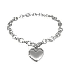 Great worn as is, can easily add charms too! This polished mirror finish stainless steel heart bracelet is a classic that will never go out of style. Since it is stainless steel, it is hypoallergenic (won't turn your wrists green), will never tarnish and is extremely durable. The chain measures a little under 1/2 inch in width with oval links. To clasp the bracelet at the end, measure your wrist, and add 1 inch. The bracelet is fully adjustable into any link in the cable chain but recommend orde Silver Heart Jewelry, Puffy Heart Charms, Silver Bracelets For Women, Bangle Bracelet Set, Charm Chain, Stainless Steel Bangles, Punk Jewelry, Waterproof Jewelry, Silver Chain Bracelet