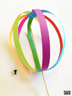 a colorful pinwheel on top of a white table