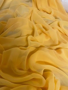 "1 mtr yellow chiffon fabric This is quality chiffon fabric It is 45\" wide (114cm) This is ideal for dress making,bridal dress, veils,decorations,and many other projects If more than one quantity is bought it will be sent in one continous length I also combine postage costs if multiple items are bought Any questions feel free to ask" Bridesmaids Outfits, Yellow Drapes, Sewing Desk, Soft Dress, Dress Chiffon, Stage Costume, Bridesmaid Outfit, Brocade Fabric, Yellow Fabric