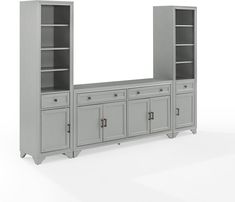 a gray entertainment center with two doors and shelves on each side, in front of a white background