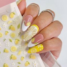 When life gives you lemons, wear them on your nails! This sticker features cute lemon and lemon blossom prints in assorted sizes, perfect for adding a splash of sunshine to your bright summer citrus and floral nails. These quality nail art stickers are made with thin adhesive materials and fine prints. Sheet Size: 8.5 x 12cm Application:Use tweezers to remove the desired piece, place on nail then seal with top coat, gel or acrylic.Please note, due to difference in monitors/displays, pictures can vary in color. Summer Nails Citrus, Summer Nails Spain, Blueberry Lemon Nails, 3d Lemon Nails, Lemon Acrylic Nails, Citrus Manicure, Citron Nails, Lemon Nails Art, Italy Nails Summer