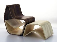 an unusual chair and ottoman made out of plywood