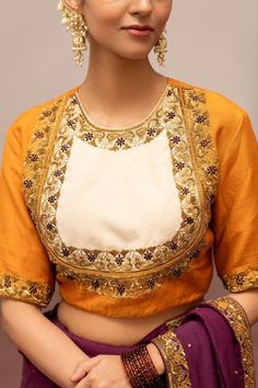 Mustard and ivory blouse with floral, sequins embroidery.
Components: 1
Pattern: Embroidery
Type Of Work: Floral, Sequins
Neckline: Round Neck
Sleeve Type: Half Sleeves
Fabric: Munga Silk
Color: Yellow
Other Details: 
Model height: 5ft 7inches, wearing size S
Note: The saree and jewellery worn by the model is not for sale
Occasion: Puja - Aza Fashions Festive Blouse With Intricate Embroidery And Traditional Drape, Festive Traditional Drape Blouse With Intricate Embroidery, Festive Chinon Blouse With Intricate Embroidery, Elegant Blouse With Intricate Embroidery In Chinon, Diwali Cotton Silk Choli With Intricate Embroidery, Elegant Chinon Blouse With Intricate Embroidery, Festive Raw Silk Blouse With Intricate Embroidery, Semi-stitched Chinon Blouse With Intricate Embroidery, Elegant Chinon Blouse With Zari Work