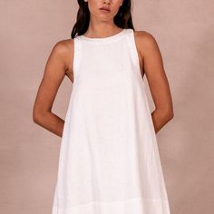 Chic A-line Linen Dress For Vacation, Chic White A-line Linen Dress, White Linen Mini Dress For Daywear, White Linen A-line Mini Dress, Linen A-line Mini Dress For Beach, Chic White Linen Dress For Day Out, Summer A-line Linen Mini Dress, Chic High Neck Beach Dress, White Linen Dress For Day Out