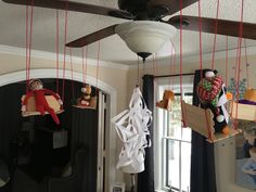 some toys are hanging from the ceiling in this room