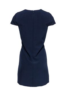 Whether it’s evening cocktails or a work lunch, this Milly dress has got you covered. With a feminine V-neck and cap sleeves, dress it up with sparkling jewelry or keep it casual with only a few delicate necklaces. The versatility within this piece is perfect for the busy woman. Size 8 Shell: 90% Polyester, 10% Elastane Lining: 100% Polyester Made in USA Concealed back zipper Lined Shift silhouette V-neckline Cap sleeve Bust 38” Shoulder to hem 33.5” Elegant Cap Sleeve Dress For Night Out, Chic Cap Sleeve Mini Dress For Formal Occasions, Elegant Short Sleeve V-neck Dress For Work, Elegant Short Sleeve Dress For Night Out, Blue Short Sleeve V-neck Formal Dress, Elegant Navy Mini Dress For Formal Occasions, Navy V-neck Dress For Work, Elegant V-neck Short Sleeve Workwear Dress, Elegant Blue Cap Sleeve Dress