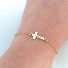 Custom Cross Bracelet, Baby First Bracelet, First Communion Gift, Baby Baptism Gift, Cross Jewelry, Rose Gold Cross, Christening Gift♥ Available in Sterling Silver, 14K Gold Filled and 14K Rose Gold Filled.♥ Please be sure to leave a name ( max. 8 letters ) OR date in the note box at checkout. Please note for date's year it will be shorten, ie. 2018 to 18.♥ Specification. Cross size 9.4 x 17mm. Comes in a satin pouch. Length includes charm, jump ring and clasp. Comes in our signature satin pouch Personalized Cross Rosary Bracelet For Baptism, Adjustable Cross Bracelets For Wedding, Adjustable Cross Bracelets For Weddings, Adjustable Cross Bracelets For Baptism, Personalized Adjustable Bracelet For Baptism, Personalized Adjustable Bracelets For Baptism, Personalized Gold Name Bracelet For Baptism, Baby Bracelet Gold, Baby Baptism Gifts