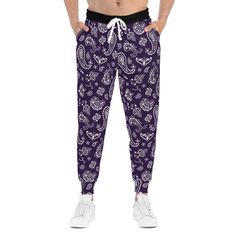 Introducing our exclusive Queen Dark Purple Bandana Print Joggers! These personalized jogging pants are designed to elevate your lounging and workouts with a touch of custom style. Crafted with meticulous attention to detail, these all-over-print joggers offer a cozy, unisex fit that ensures comfort and versatility. The cut & sew construction guarantees a higher quality product, both in terms of the materials used and the overall production standards. Made from a soft blend of 95% polyester and Casual Purple Sweatpants With Elastic Waistband, Purple Athleisure Sweatpants With Elastic Waistband, Casual Purple Joggers For Loungewear, Purple Relaxed Fit Sweatpants For Athleisure, Purple Cotton Athleisure Pants, Purple Athleisure Joggers With Pockets, Purple Sweatpants With Relaxed Fit And Elastic Waistband, Casual Purple Joggers With Pockets, Purple Athleisure Joggers For Loungewear