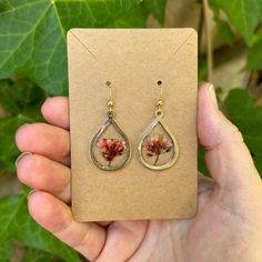 Lovely Red/Coral Flowers In Base Metal Bezel With 14k Gold Filled Ear Wires Red Pressed Flowers Earrings For Gift, Red Round Jewelry With Pressed Flowers, Red Pressed Flowers Round Jewelry, Floral Resin, Coral Flowers, Resin Earrings, Red Coral, Base Metal, Ear Wires