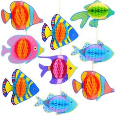 an assortment of colorful fish hanging from strings