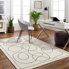 a white rug with black circles on it in front of a computer desk and chair