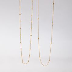 🌟 Elevate your style with our 14k solid gold satellite beaded ball chain necklace. This delicate and minimalist necklace features evenly spaced gold beads, making it perfect for layering or wearing alone. Ideal for everyday wear and special occasions, this timeless piece adds a touch of sophistication to any outfit. Perfect for birthdays, anniversaries, or just because. ✨ Perfect For:     Birthdays 🎉     Anniversaries 💕     Everyday Elegance 🌼 Order now to add a versatile and elegant piece t Minimalist Tiny Beads Chain Necklace For Everyday, Everyday Minimalist Ball Chain Necklace, Minimalist Ball Chain Necklace With Round Beads, Minimalist Beaded Clavicle Chain Necklace For Everyday, Everyday Minimalist Beaded Necklace With Delicate Chain, Minimalist Necklace With Ball Chain And Round Beads, Minimalist Ball Chain Necklace, Dainty Yellow Gold Beaded Necklaces With Satellite Chain, Dainty Yellow Gold Beaded Necklace With Satellite Chain