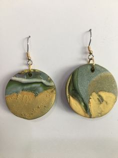 "Lightweight polymer clay circle dangle earrings in gold, silver, black and a hint of green (about 1 1/5\" diameter).  These are very versatile earrings.  They will look great with black, white, naturals and greens. Gold color french hooks. All my current jewelry has been made during this period of odd quarantine and everything seems to have a festive feel.  Everything is colorful, happy, and bold.   Maybe the pieces are even hopeful.  The polymer clay beads have added a whole new dimension to m Feel Everything, African Earrings, Artisan Earrings, Handcrafted Accessories, Earrings In Gold, Colorful Earrings, African Jewelry, Polymer Clay Beads, Earrings Dangle