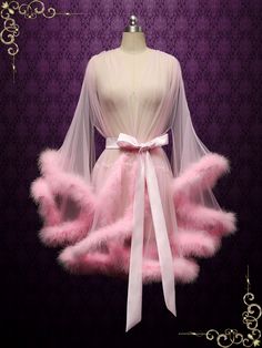 This marabou fur edged boudoir robe is incredibly sexy and playful, perfect for your honeymoon! Photoed in a pink shade, can be made in other colors of your choice. Long： Approx 57-59 inches long Short : Approx 35 inches Long Working Time: 1-2 weeks Rush Order or customization please inquire prior to order. Custom Designs We specialize in custom design services.If there's a dress you like and it's not on our website,you're more than welcome to email us a picture of the dress for a quote. Fluffy Short Hair, Honeymoon Robe, Fancy Robes, Fur Outfit, Bridal Honeymoon, Fur Dress, Wedding Robe, Pink Fur, Pink Shade