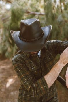 Hollywood | Mens Leather Cowboy Hat The Hollywood mens leather cowboy hat is one of the most popular hats in history. This hat has been worn by some of the most famous people in history and now it can be yours! This cowboy hat is cut and made from genuine leather and stitched with care. Western Style Hat Bands For Country Events, Flat Brim Hats With Leather Sweatband For Country Events, Rugged Fedora Hats For Ranch, Brimmed Hats With Leather Sweatband For Country Events, Western Hat With Leather Sweatband For Western-themed Events, Western Leather Hat Bands For Rodeo, Rugged Curved Brim Hat For Rodeo, Country Style Hat With Leather Sweatband For Country Events, Leather Fedora With Flat Brim For Ranch