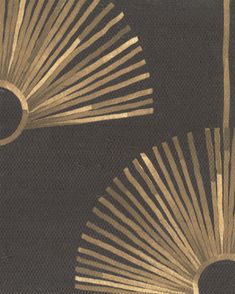 two gold fan shaped objects on a black background, one with white and yellow stripes