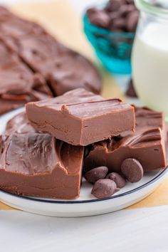 pieces of chocolate on a plate next to milk