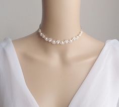 This is an original design by © Isabella Bridal. Details - Swarovski pearls - Lobster clasp closure with 2 inches extender chain. Feel free to contact me with any questions! Custom orders welcome. All orders will ship within 48 hours, except for weekends ALL ORDERS ARE SHIPPED VIA USPS FIRST CLASS WITH TRACKING. Handmade in the USA This item is Made-to-Order and therefore is a final sale. Adjustable Pearl Embellished Bridal Necklace For Wedding, Adjustable Pearl Chain Necklace For Wedding, White Bridal Pearl Choker Necklace, Pearl Choker Bridal Necklace For Wedding, Adjustable Pearl Chain Bridal Necklace For Weddings, Wedding Pearl Chain Choker Bridal Necklace, Wedding Pearl Choker Bridal Necklace, Pearl White Pearl Necklace Choker For Wedding, Pearl Bridal Choker For Wedding