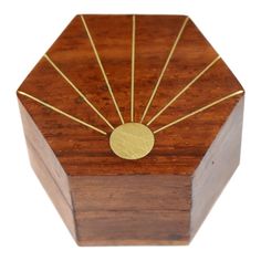 a wooden box with gold sunbursts on it