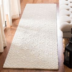 a long white rug on the floor in a living room