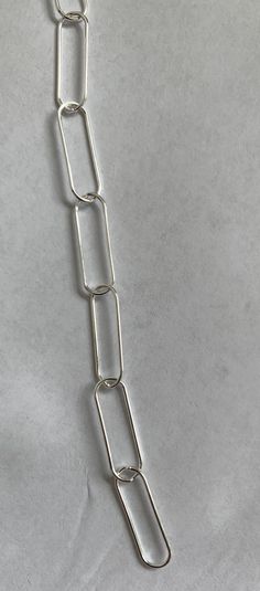 Sterling silver chain Paper clip chain Link size 6.5x20 mm Us$ 13.99 per foot Silver Paperclip Bracelet With Chunky Oval Link, Silver Link Paperclip Bracelet With Chunky Chain, Silver Chunky Chain Link Paperclip Bracelet, Silver Link Paperclip Bracelet, Silver Chain Link Paperclip Bracelet, Silver Link Paperclip Bracelet With Cable Chain, Silver Paperclip Bracelet With Oval Links, Silver Paperclip Bracelet With Oval Link Box Chain, Silver Sterling Paperclip Bracelet