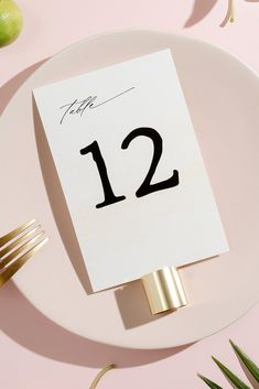 a white plate topped with a table number