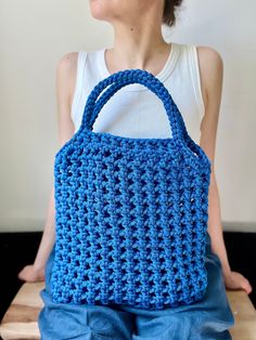 Blue handmade crochet bag, the perfect accessory for your everyday adventures! Handcrafted with care and attention to detail, this lightweight crochet shoulder  combines style and functionality effortlessly.  The net pattern design adds a catch eye  flair to any outfit. Its spacious interior offers ample room for your essentials, whether you're heading to the market, strolling through the city, or enjoying a day at the beach. The crochet tote bag can also be a great handmade gift for mother, dau Summer Crochet Macrame Bag For Everyday, Summer Everyday Crochet Macrame Bag, Summer Everyday Macrame Crochet Bag, Summer Macrame Crochet Bag, Summer Macrame Crochet Bag For Everyday Use, Blue Crochet Bag With Granny Square For Everyday, Blue Crochet Beach Bag For Everyday Use, Yarn Crochet Bag For Everyday Summer Use, Everyday Summer Crochet Yarn Bag