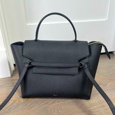 - Size: Mini (I.E. Largest Available Size Despite Its Name) Dimensions Below. - Color: Black Calfskin - Condition: Like New. Pristine Condition With No Signs Of Wear Or Scratches. Used Less Than 5 Times. - Other Notes: Bought In 2019 During Phoebe Philo Era So Has An Accent Above The First “E” In “Cline”. Mini : 11 X 9 X 6 In (27 X 23 X 16 Cm) Shoulder And Hand Carry Removable Leather Strap With 14 In (36 Cm) Drop Black Calf Leather Bag With Detachable Strap, Timeless Black Calf Leather Bags, Designer Black Calf Leather Bags, Black Designer Calf Leather Bag, High-end Black Calf Leather Bag, Black Calf Leather Office Bag, Luxury Everyday Black Shoulder Bag With Handle Drop, Timeless Black Bag For Everyday Luxury, Elegant Black Calf Leather Shoulder Bag