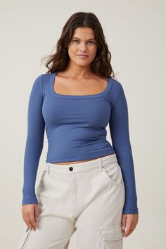 Staple Rib Scoop Neck Long Sleeve Top Blue Scoop Neck Elastane Top, Fitted Scoop Neck Top For Layering, Versatile Stretch Square Neck Top, Stretch Square Neck Tops In Elastane, Trendy Cotton Knit Top With Scoop Neck, Casual Cropped Elastane Tops, Trendy Relaxed Fit Scoop Neck Top, Casual Scoop Neck Tops For Fall, Fitted Blue Tops With Square Neck